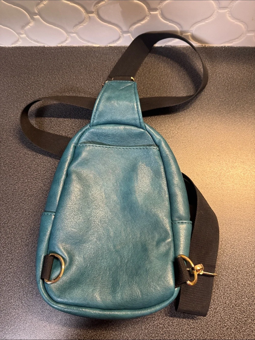 Kedzie Sunset sling bag in teal